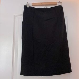 White House Black Market black knee length skirt size 4. Fully lined. Side zip.